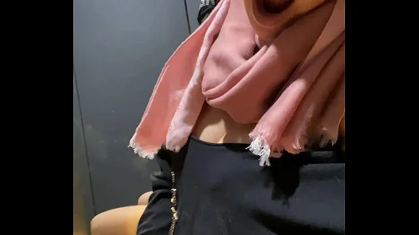 Secretly pussy fingered to orgasm in shopping center dressing room